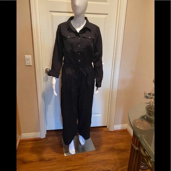 Black cotton utility button down jumpsuit.